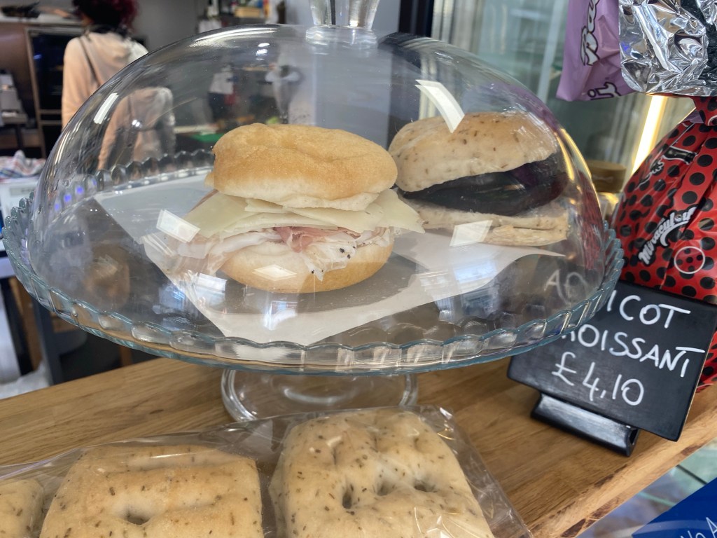 glass cloche containing gluten free sandwiches